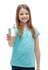 Image showing smiling little girl giving glass of water