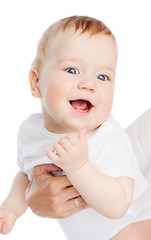 Image showing close up of mother holding smiling baby