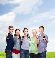 Image showing students showing blank smartphones screens