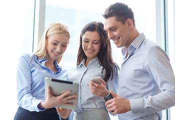 Image showing business team working with tablet pcs in office