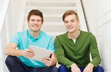 Image showing smiling male students with tablet pc computer