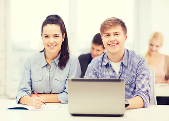 Image showing students with laptop and notebooks at school