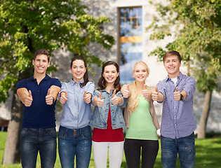 Image showing group of smiling students showing thumbs up