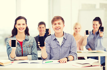 Image showing students showing black blank smartphone screens