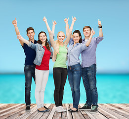 Image showing group of smiling students showing thumbs up