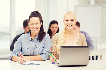 Image showing students with laptop and notebooks at school