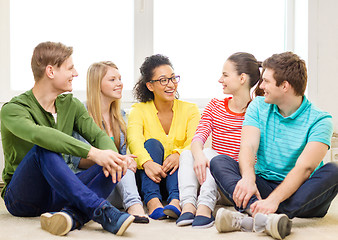 Image showing five smiling teenagers having fun at home