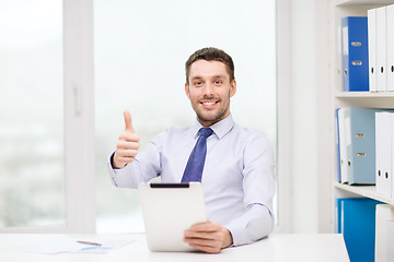 Image showing smiling businessman with tablet pc and documents