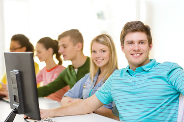 Image showing male student with classmates in computer class