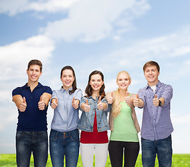 Image showing group of smiling students showing thumbs up