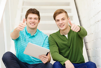 Image showing smiling male students with tablet pc computer