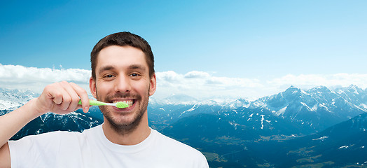 Image showing smiling young man with toothbrush