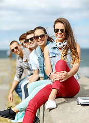 Image showing teenage girl hanging out with friends outdoors