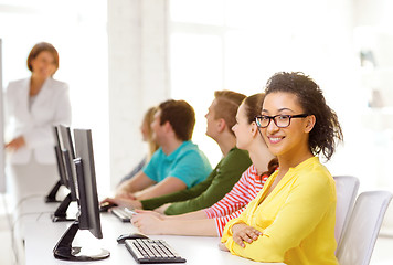 Image showing female student with classmates in computer class