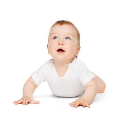 Image showing crawling curious baby looking up