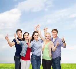 Image showing group of smiling students showing thumbs up