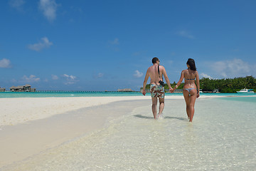 Image showing happy young couple have fun on beach