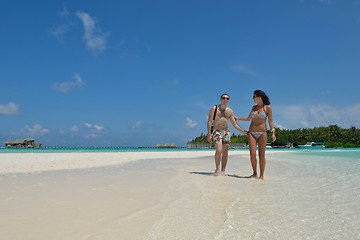 Image showing happy young couple have fun on beach