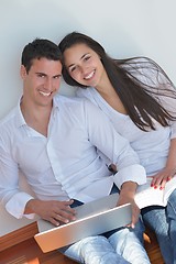 Image showing young couple using laptop at home