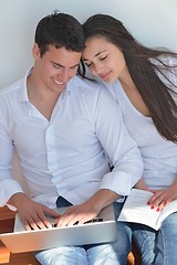 Image showing young couple using laptop at home