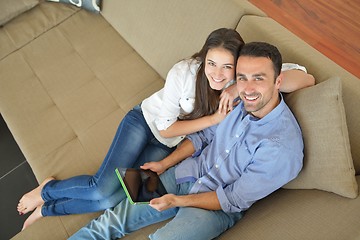 Image showing couple at home using tablet computer