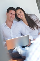 Image showing young couple using laptop at home