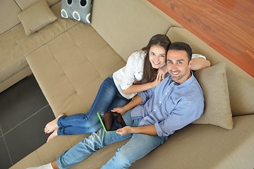 Image showing couple at home using tablet computer