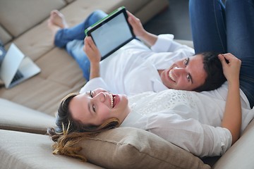 Image showing couple at home using tablet computer