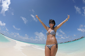 Image showing beautiful young woman  on beach have fun and relax