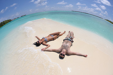 Image showing happy young couple have fun on beach