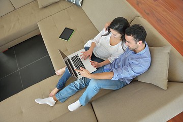 Image showing young couple using laptop at home