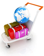 Image showing Trolley for luggage at the airport and earth. International tour