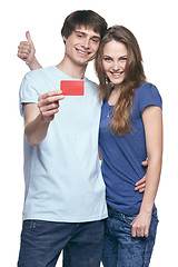 Image showing Happy couple with credit card