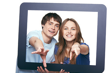 Image showing Happy couple looking through tablet frame