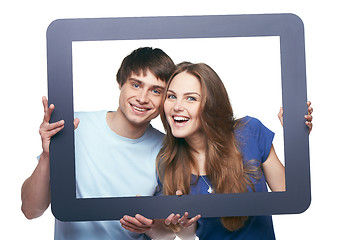 Image showing Happy couple looking through tablet frame