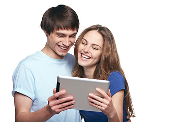 Image showing Closeup of young couple laughing while websurfing on internet