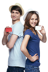 Image showing Happy couple showing credit cards