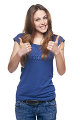 Image showing Smiling emotional girl pointing to the side