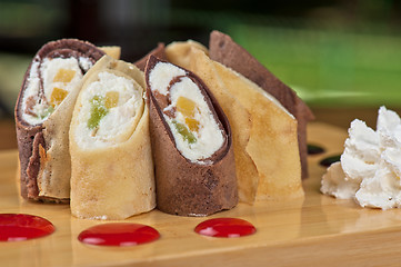 Image showing pancake roll with marmalade