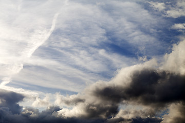 Image showing Sunny sky with dark clouds