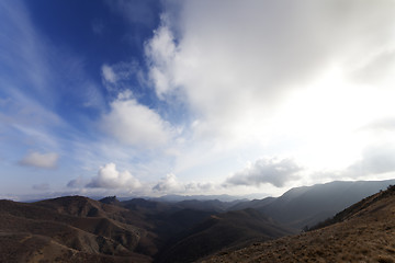 Image showing Mountains and blue sky with clouds