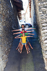 Image showing Funny family on narrow street