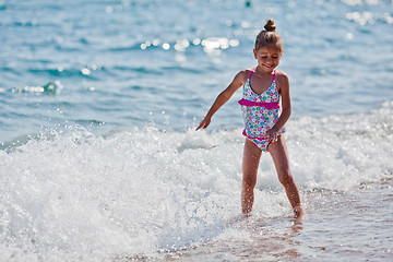 Image showing Little five year old girl at the beach