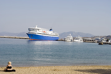 Image showing woman on beach harbor with boats