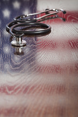 Image showing Stethoscope with American Flag Reflection on Table