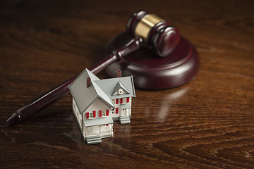 Image showing Gavel and Small Model House on Table