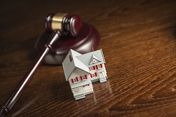 Image showing Gavel and Small Model House on Table