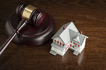 Image showing Gavel and Small Model House on Table