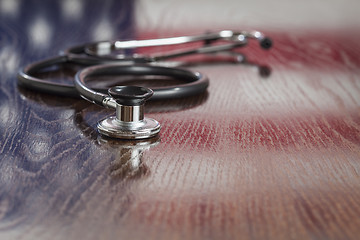 Image showing Stethoscope with American Flag Reflection on Table