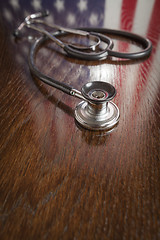 Image showing Stethoscope with American Flag Reflection on Table